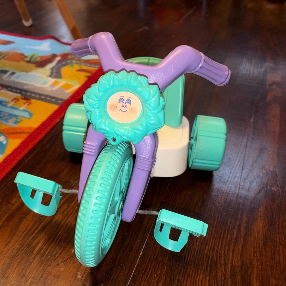 Vintage Cabbage Patch Kids doll-sized tricycle, also known as a "Free Wheeler"